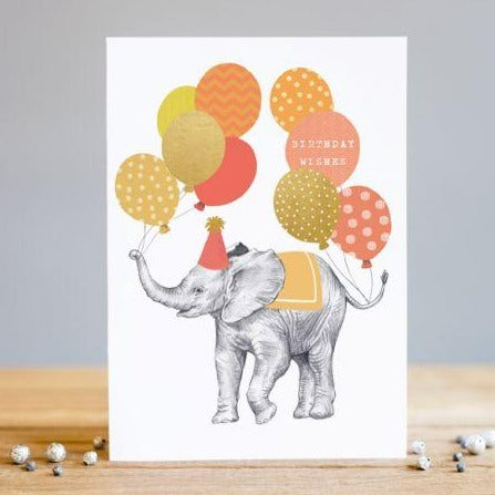 illustrated elephant holding balloons in trunk wearing birthday hat, gold foil accents,  cover message birthday wishes